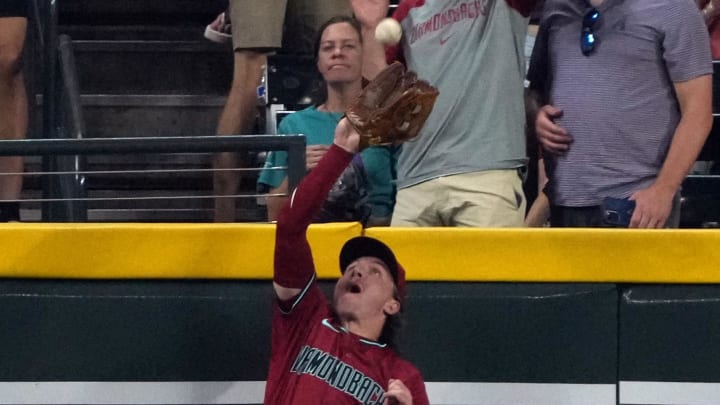 Jul 11, 2024; Phoenix, Arizona, USA; Arizona Diamondbacks outfielder Jake McCarthy (31) makes the catch for an out against the Atlanta Braves in the ninth inning at Chase Field. Mandatory Credit: Rick Scuteri-USA TODAY Sports
