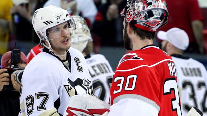 May 26, 2009; Raleigh, NC, USA; Pittsburgh Penguins center Sidney Crosby (87) and Carolina Hurricanes goalie Cam Ward (30) shake hands after the game four of the eastern conference finals of the 2009 Stanley Cup playoffs at the RBC Center. The Penguins defeated the Hurricanes 4-1 to advance to the Stanley Cup finals. Mandatory Credit: James Guillory-Imagn Images