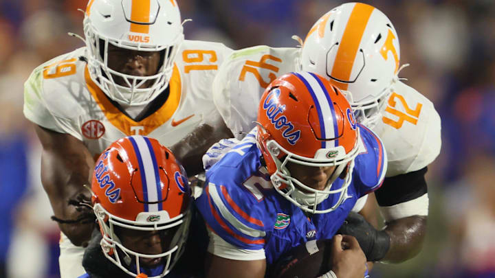 Florida WR TJ Abrams (4) and Florida QB DJ Lagway (2) gets snatched off their feet by Tennessee DL Tyre West (42) Florida WR TJ Abrams (4) and Florida QB DJ Lagway (2) gets snatched off their feet by Tennessee DL Tyre West (42)