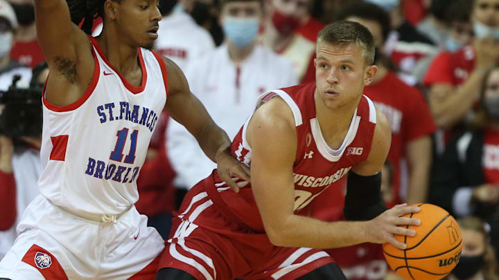 Nov 9, 2021; Madison, Wisconsin, USA;  Wisconsin Badgers guard Brad Davison (34) looks to pass as