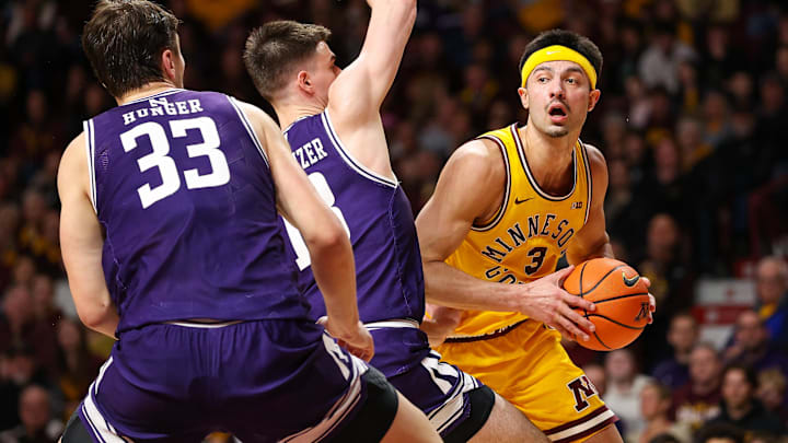 Minnesota Golden Gophers forward Dawson Garcia (3) works around Northwestern Wildcats guard Brooks Barnhizer (13) during the first half at Williams Arena. 