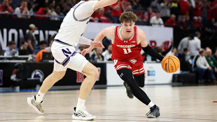Wisconsin Badgers guard Max Klesmit (11) works around Northwestern Wildcats forward Nick Martinelli (2) during the second half at Target Center.