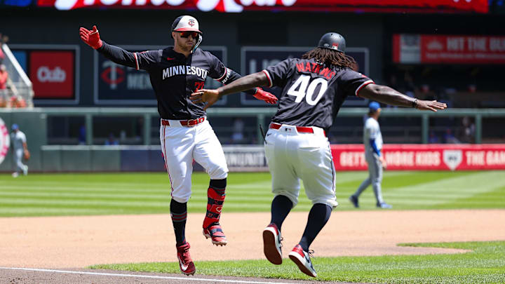 May 30, 2024; Minneapolis, Minnesota, USA; Minnesota Twins designated hitter Ryan Jeffers (27) celebrates his two-run home run with third base coach Tommy Watkins (40) during the fourth inning against the Kansas City Royals at Target Field. Mandatory Credit: Matt Krohn-USA TODAY Sports