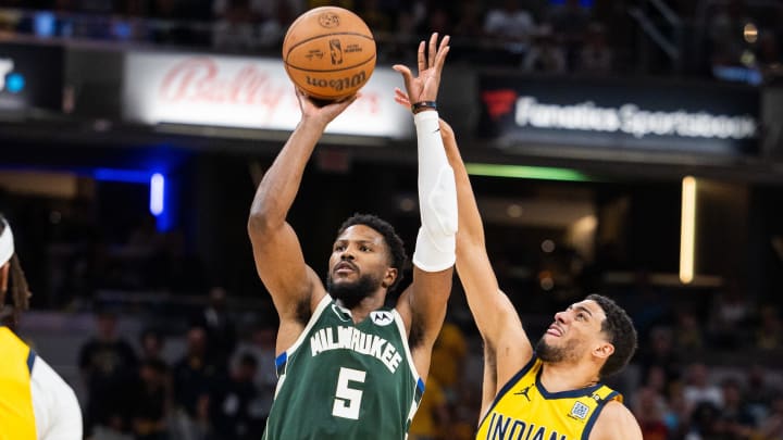 Apr 28, 2024; Indianapolis, Indiana, USA; Milwaukee Bucks guard Malik Beasley (5) shoots the ball while Indiana Pacers guard Tyrese Haliburton (0) defends during game four of the first round for the 2024 NBA playoffs at Gainbridge Fieldhouse. Mandatory Credit: Trevor Ruszkowski-USA TODAY Sports Apr 28, 2024; Indianapolis, Indiana, USA; Milwaukee Bucks guard Malik Beasley (5) shoots the ball while Indiana Pacers guard Tyrese Haliburton (0) defends during game four of the first round for the 2024 NBA playoffs at Gainbridge Fieldhouse. Mandatory Credit: Trevor Ruszkowski-USA TODAY Sports