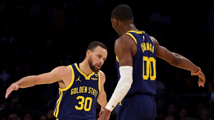 Mar 16, 2024; Los Angeles, California, USA; Golden State Warriors guard Stephen Curry (30) celebrates with forward Jonathan Kuminga (00) after a basket during the third quarter against the Los Angeles Lakers at Crypto.com Arena. Mandatory Credit: Jason Parkhurst-Imagn Images Mar 16, 2024; Los Angeles, California, USA; Golden State Warriors guard Stephen Curry (30) celebrates with forward Jonathan Kuminga (00) after a basket during the third quarter against the Los Angeles Lakers at Crypto.com Arena. Mandatory Credit: Jason Parkhurst-Imagn Images