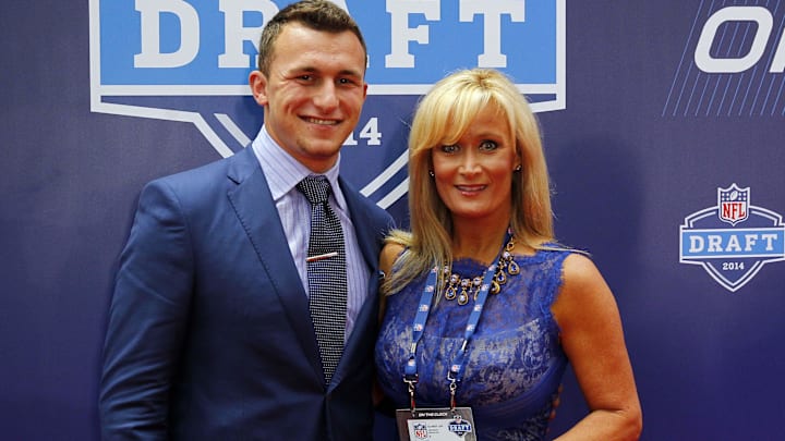 May 8, 2014; New York, NY, USA;  Johnny Manziel (Texas A&M) stands with his mom Michelle Manziel for a photo during the NFL Draft red carpet arrivals at Radio City Music Hall. Mandatory Credit: Andy Marlin-Imagn Images