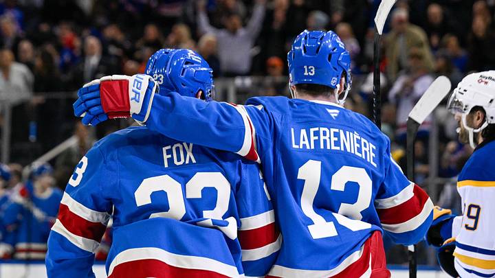 Apr 8, 2026; New York, New York, USA; New York Rangers defenseman Adam Fox (23) celebrates his goal with New York Rangers left wing Alexis Lafrenière (13) against the Buffalo Sabres during the second period at Madison Square Garden. 