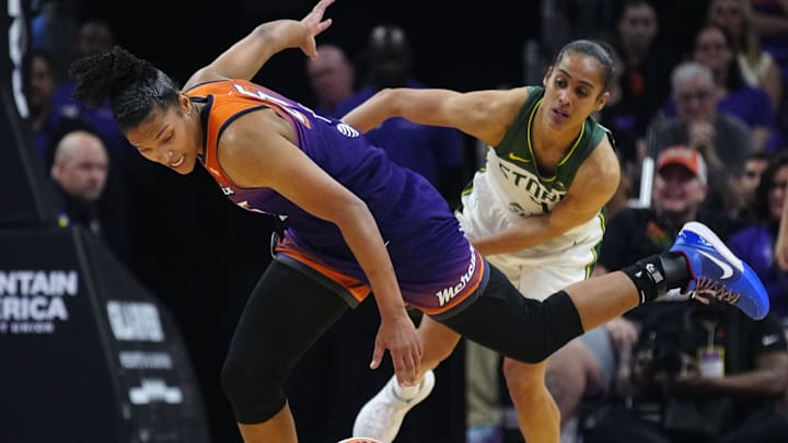 Seattle Storm guard Skylar Diggins (4) fouls Phoenix Mercury forward Alyssa Thomas (25) after a Thomas steal during the Mercury home opener in the PHX Arena in Phoenix on May 17, 2025.