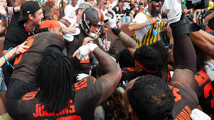 Browns kicker Andre Szmyt, center, is mobbed by teammates and fans after kicking the game-winning field goal to beat the Green Bay Packers, Sept. 21, 2025, in Cleveland.