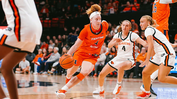 Illinois guard Gretchen Dolan (4) drives on a pair of Oregon State defenders in the Illini's loss to the Beavers last week in Corvallis, Oregon.