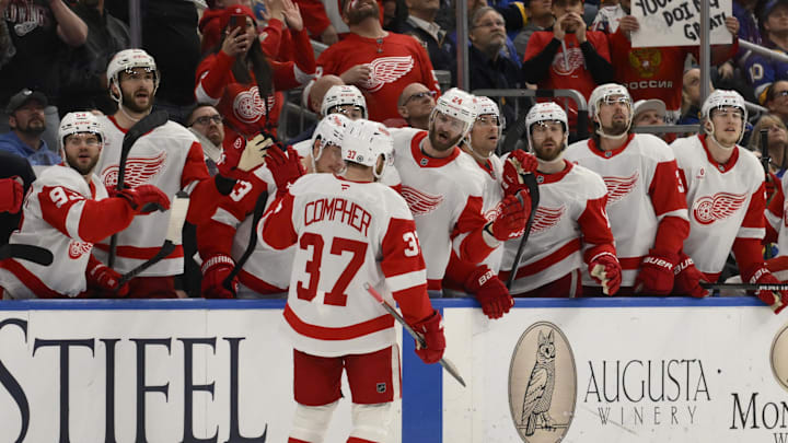 Apr 1, 2025; St. Louis, Missouri, USA; Detroit Red Wings left wing J.T. Compher (37) is congratulated by teammates after scoring a goal against the St. Louis Blues during the third period at Enterprise Center. Mandatory Credit: Jeff Le-Imagn Images