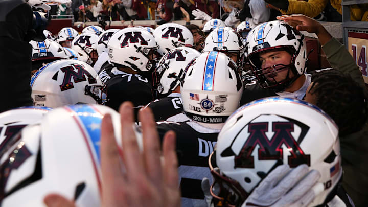 Nov 1, 2025; Minneapolis, Minnesota, USA; Minnesota Golden Gophers players celebrate Minnesota Golden Gophers quarterback Drake Lindsey’s game winning touchdown during overtime against the Michigan State Spartans at Huntington Bank Stadium. Mandatory Credit: Matt Krohn-Imagn Images