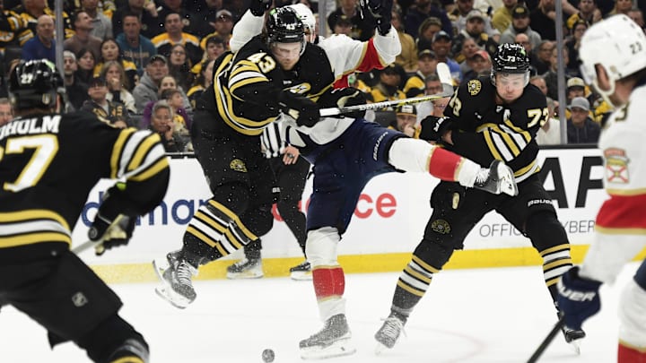 May 17, 2024; Boston, Massachusetts, USA; Boston Bruins center Danton Heinen (43) checks Florida Panthers center Sam Bennett (9) during the second period in game six of the second round of the 2024 Stanley Cup Playoffs at TD Garden. Mandatory Credit: Bob DeChiara-Imagn Images