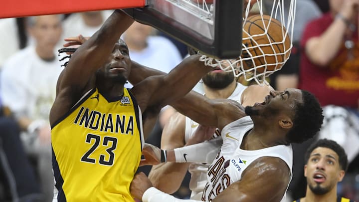 May 6, 2025; Cleveland, Ohio, USA; Indiana Pacers forward Aaron Nesmith (23) dunks beside Cleveland Cavaliers guard Donovan Mitchell (45) in the fourth quarter during game two of the second round of the 2025 NBA Playoffs at Rocket Arena. Mandatory Credit: David Richard-Imagn Images