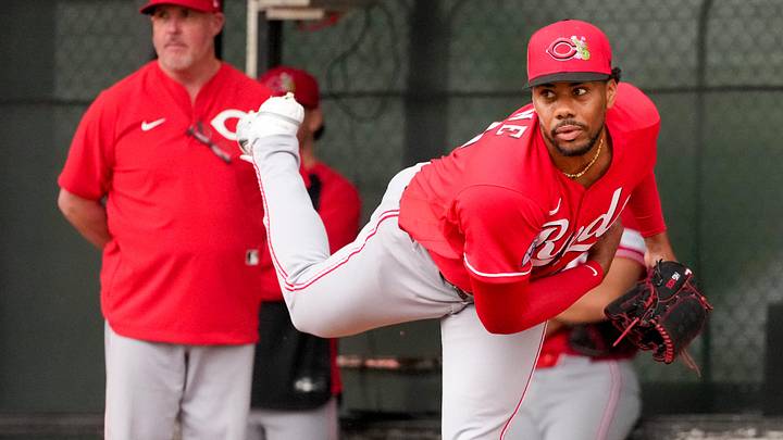 Cincinnati Reds pitcher Hunter Greene (21) throws a bullpen session with pitching coach/director of pitching Derek Johnson (36) at the Cincinnati Reds player development complex in Goodyear, Ariz., on Friday, Feb. 13, 2026. Cincinnati Reds pitcher Hunter Greene (21) throws a bullpen session with pitching coach/director of pitching Derek Johnson (36) at the Cincinnati Reds player development complex in Goodyear, Ariz., on Friday, Feb. 13, 2026.