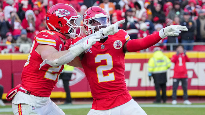 Dec 21, 2024; Kansas City, Missouri, USA; Kansas City Chiefs cornerback Joshua Williams (2) celebrates with linebacker Drue Tranquill (23) after a sack against the Houston Texans during the second half at GEHA Field at Arrowhead Stadium. Mandatory Credit: Denny Medley-Imagn Images