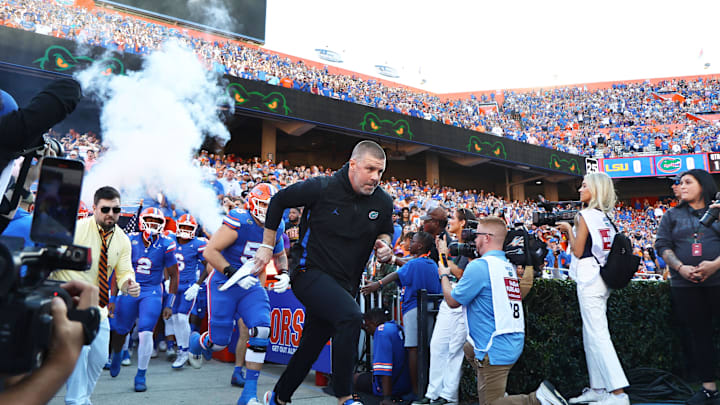 Nov 16, 2024; Gainesville, Florida, USA; Florida Gators head coach Billy Napier leads the team out of the tunnel prior to the game against the LSU Tigers  at Ben Hill Griffin Stadium. Mandatory Credit: Kim Klement Neitzel-Imagn Images