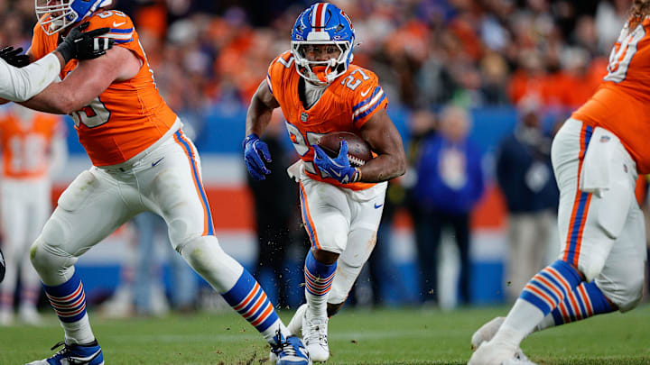 Nov 6, 2025; Denver, Colorado, USA; Denver Broncos running back J.K. Dobbins (27) runs the ball in the fourth quarter against the Las Vegas Raiders at Empower Field at Mile High. Mandatory Credit: Isaiah J. Downing-Imagn Images