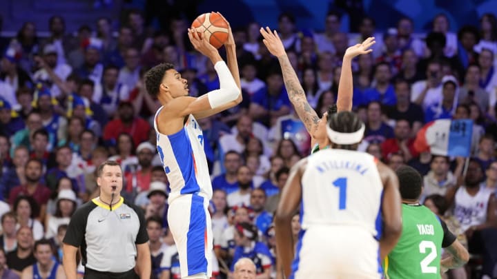 Jul 27, 2024; Villeneuve-d'Ascq, France; France power forward Victor Wembanyama (32) shoots against Brazil during the Paris 2024 Olympic Summer Games at Stade Pierre-Mauroy. Mandatory Credit: John David Mercer-USA TODAY Sports