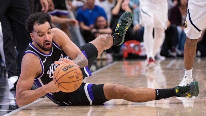 Apr 9, 2025; Sacramento, California, USA; Sacramento Kings forward Trey Lyles (41) attempts to control the ball during the fourth quarter of the game against the Denver Nuggets at Golden 1 Center. Mandatory Credit: Ed Szczepanski-Imagn Images