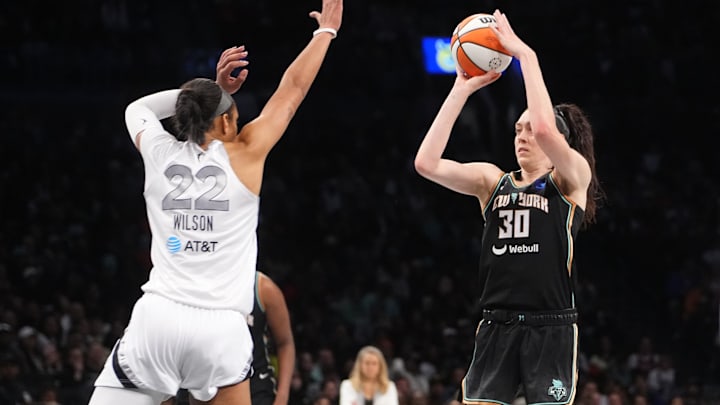 Sep 29, 2024; Brooklyn, New York, USA; New York Liberty forward Breanna Stewart (30) shoots a jump shot over Las Vegas Aces center A'ja Wilson (22) during game one of the 2024 WNBA Semi-finals at Barclays Center. Mandatory Credit: Gregory Fisher-Imagn Images