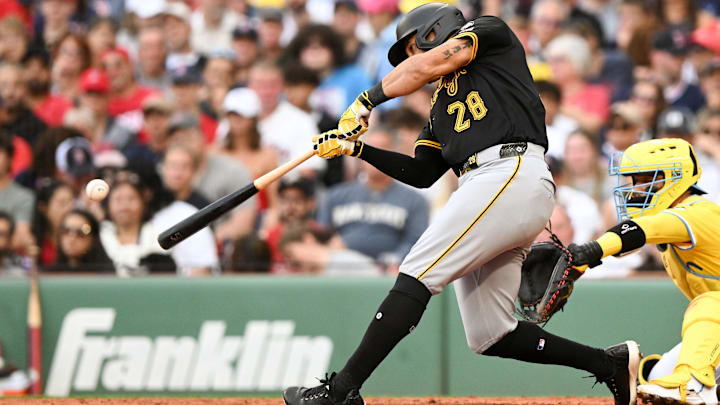 Aug 30, 2025; Boston, Massachusetts, USA; Pittsburgh Pirates left fielder Tommy Pham (28) hits a RBI single against the Boston Red Sox during the fifth inning at Fenway Park. Mandatory Credit: Brian Fluharty-Imagn Images