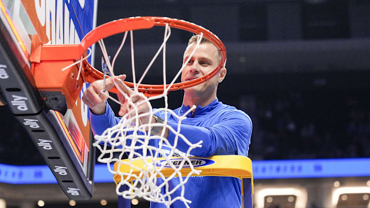 Who do the experts have cutting down the nets at the end of the NCAA Tournament?