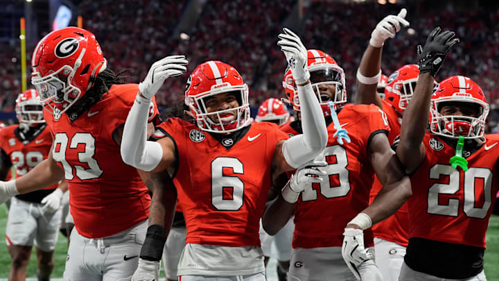 Georgia defensive back Daylen Everette (6) celebrates with his teammates after an interception against Texas during the second half of the 2024 SEC championship game at Mercedes-Benz Stadium in Atlanta.