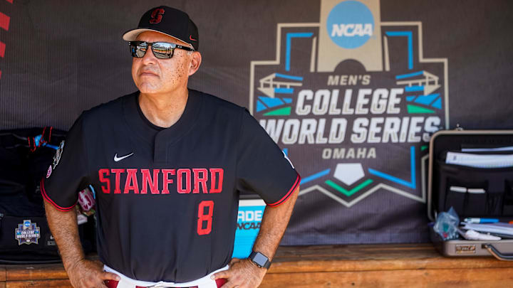 Jun 19, 2023; Omaha, NE, USA; Stanford Cardinal head coach David Esquer stands in the dugout before the game against the Tennessee Volunteers at Charles Schwab Field Omaha. Mandatory Credit: Dylan Widger-Imagn Images
