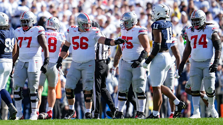 Ohio State Buckeyes offensive linemen Tegra Tshabola (77), Seth McLaughlin (56), Carson Hinzman (75) and Donovan Jackson (74) line up against Penn State at Beaver Stadium. Ohio State Buckeyes offensive linemen Tegra Tshabola (77), Seth McLaughlin (56), Carson Hinzman (75) and Donovan Jackson (74) line up against Penn State at Beaver Stadium.