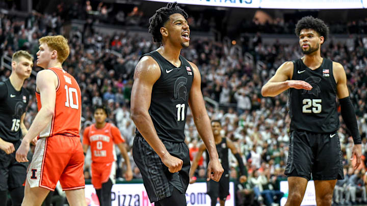 Michigan State's A.J. Hoggard celebrates after making a basket and drawing an Illinois foul during