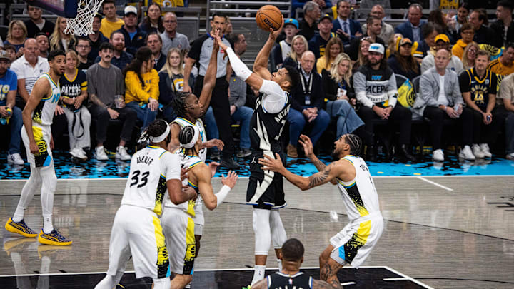 Apr 22, 2025; Indianapolis, Indiana, USA; Milwaukee Bucks forward Giannis Antetokounmpo (34) shoots the ball while Indiana Pacers forward Aaron Nesmith (23) defends during game two of first round for the 2025 NBA Playoffs at Gainbridge Fieldhouse. Mandatory Credit: Trevor Ruszkowski-Imagn Images