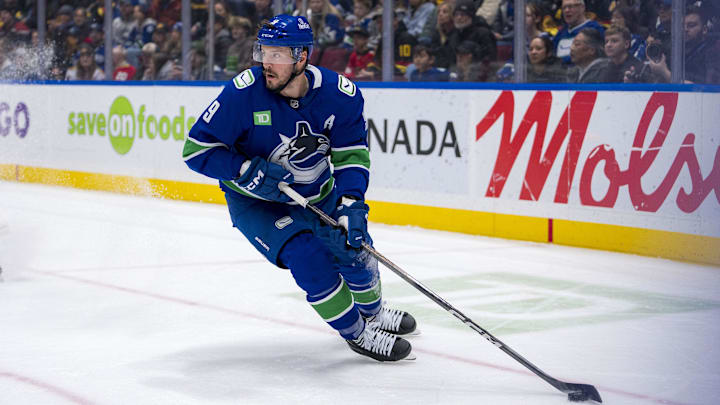 Nov 16, 2024; Vancouver, British Columbia, CAN; Vancouver Canucks forward J.T. Miller (9) handles the puck against the Chicago Blackhawks during the first period at Rogers Arena. Mandatory Credit: Bob Frid-Imagn Images