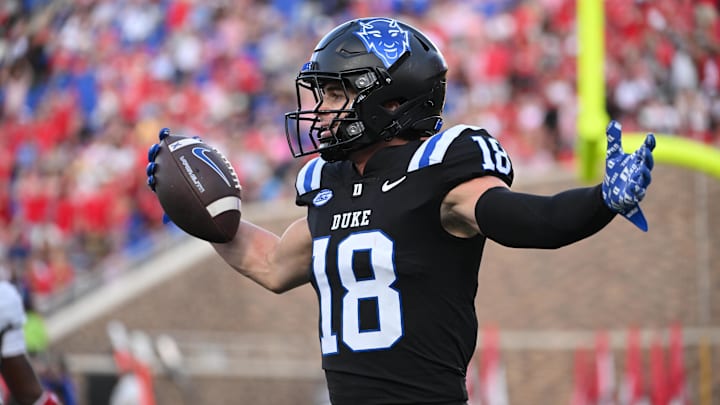 Sep 20, 2025; Durham, North Carolina, USA; Duke Blue Devils wide receiver Cooper Barkate (18) celebrates a touchdown during the third quarter against the NC State Wolfpack at Wallace Wade Stadium. Mandatory Credit: Zachary Taft-Imagn Images Sep 20, 2025; Durham, North Carolina, USA; Duke Blue Devils wide receiver Cooper Barkate (18) celebrates a touchdown during the third quarter against the NC State Wolfpack at Wallace Wade Stadium. Mandatory Credit: Zachary Taft-Imagn Images