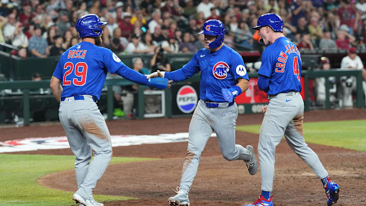 Chicago Cubs first baseman Michael Busch (29), second baseman Matt Shaw (6) and outfielder Pete Crow-Armstrong (4) celebrate. Chicago Cubs first baseman Michael Busch (29), second baseman Matt Shaw (6) and outfielder Pete Crow-Armstrong (4) celebrate.