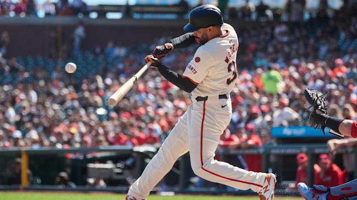 Sep 28, 2024; San Francisco, California, USA; San Francisco Giants infielder LaMonte Wade Jr. (31) hits an RBI single against the St. Louis Cardinals during the first inning at Oracle Park. Sep 28, 2024; San Francisco, California, USA; San Francisco Giants infielder LaMonte Wade Jr. (31) hits an RBI single against the St. Louis Cardinals during the first inning at Oracle Park.