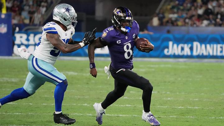 Sep 27, 2026; Rio De Janeiro, BRA; Baltimore Ravens quarterback Lamar Jackson (8) runs with the ball past Dallas Cowboys linebacker Dee Winters (53) during the game at Maracana Stadium. Mandatory Credit: Kirby Lee-Imagn Images Sep 27, 2026; Rio De Janeiro, BRA; Baltimore Ravens quarterback Lamar Jackson (8) runs with the ball past Dallas Cowboys linebacker Dee Winters (53) during the game at Maracana Stadium. Mandatory Credit: Kirby Lee-Imagn Images