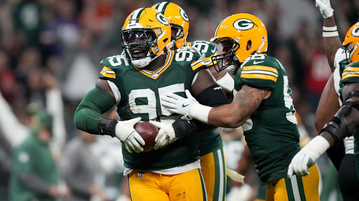 Green Bay Packers defensive tackle Devonte Wyatt (95) celebrates with teammates after recovering a fumble during the first quarter against the Philadelphia Eagles at Neo Quimica Arena.