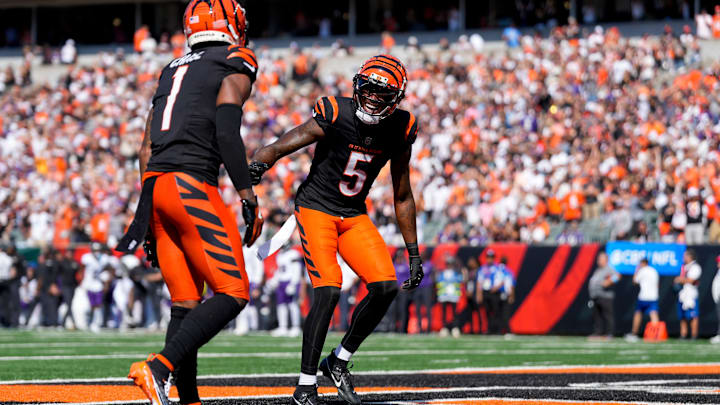 Cincinnati Bengals wide receiver Ja'Marr Chase (1) and wide receiver Tee Higgins (5) celebrate the Chase touchdown in the second quarter of the NFL Week 5 game between the Cincinnati Bengals and Baltimore Ravens at Paycor Stadium in downtown Cincinnati on Sunday, Oct. 6, 2024. The Bengals led 17-14 at halftime.