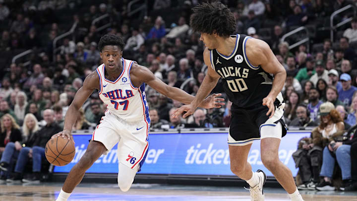 Dec 5, 2025; Milwaukee, Wisconsin, USA; Philadelphia 76ers guard VJ Edgecombe (77) drives to the basket against Milwaukee Bucks center Jericho Sims (00) in the second half at Fiserv Forum. Mandatory Credit: Michael McLoone-Imagn Images