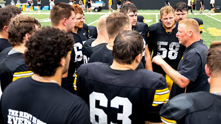Iowa offensive line coach George Barnett talks with players during the Aug. 9 Kids Day open practice at Kinnick Stadium in Iowa City. Iowa offensive line coach George Barnett talks with players during the Aug. 9 Kids Day open practice at Kinnick Stadium in Iowa City.