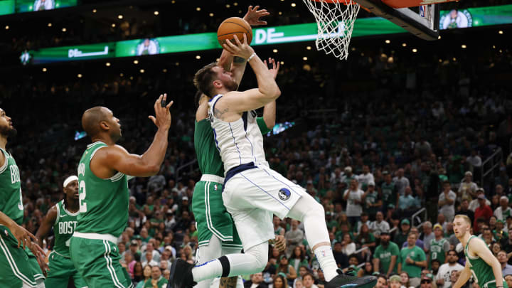Jun 17, 2024; Boston, Massachusetts, USA; Dallas Mavericks guard Luka Doncic (77) shoots the ball against Boston Celtics forward Jayson Tatum (0) during the second quarter in game five of the 2024 NBA Finals at TD Garden. Mandatory Credit: Peter Casey-USA TODAY Sports