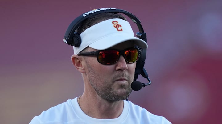 Oct 21, 2023; Los Angeles, California, USA; Southern California Trojans head coach Lincoln Riley watches from the sidelines against the Utah Utes in the first half at United Airlines Field at Los Angeles Memorial Coliseum. Mandatory Credit: Kirby Lee-Imagn Images Oct 21, 2023; Los Angeles, California, USA; Southern California Trojans head coach Lincoln Riley watches from the sidelines against the Utah Utes in the first half at United Airlines Field at Los Angeles Memorial Coliseum. Mandatory Credit: Kirby Lee-Imagn Images