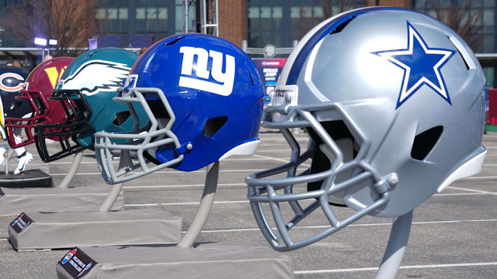 NFC East helmets of the Dallas Cowboys, New York Giants, Philadelphia Eagles, and Washington Commanders.