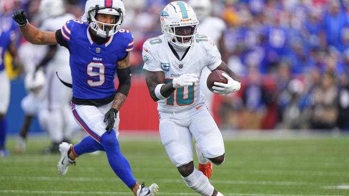 Miami Dolphins wide receiver Tyreek Hill (10) runs with the ball against Buffalo Bills safety Taylor Rapp (9) during the second half at Highmark Stadium last Sunday.