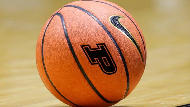 A NCAA women's basketball with the Purdue University logo 