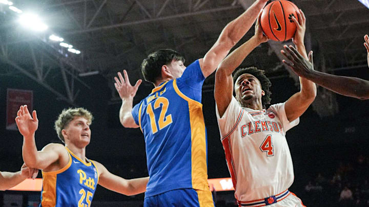 Clemson guard Butta Johnson (4)attempts a shot near University of Pittsburgh center Kieran Mullen (12) during the first half at Littlejohn Coliseum in Clemson, S.C Saturday, January 31, 2025.