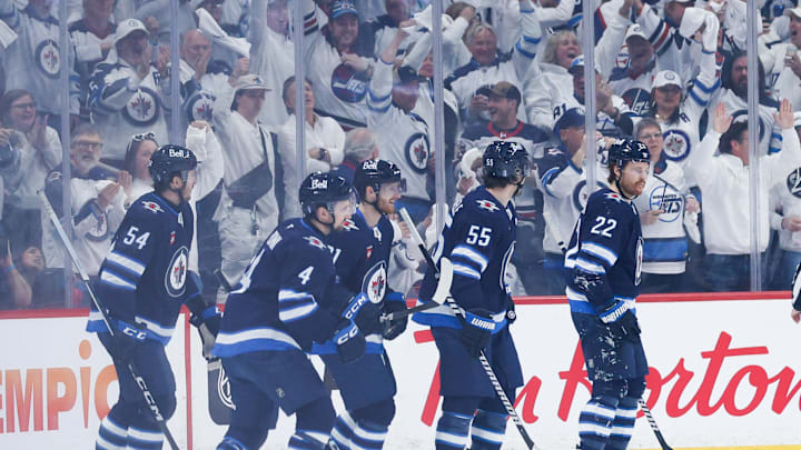Winnipeg Jets forward Kyle Connor is congratulated by his teammates on his goal against the St. Louis Blues.