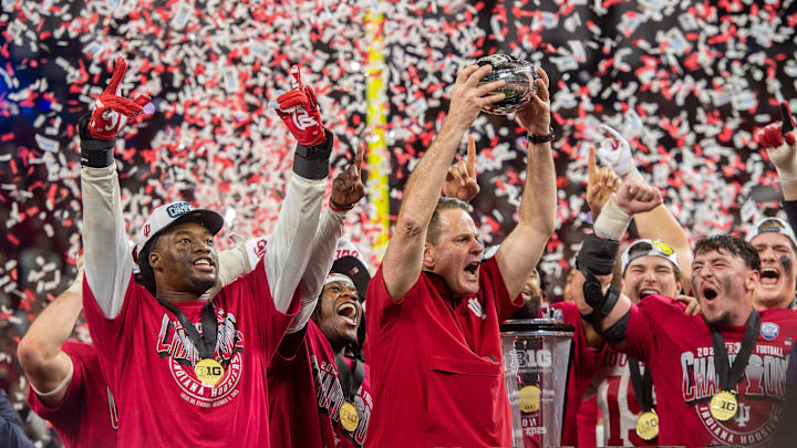 Indiana Head Coach Curt Cignetti and the Hoosiers celebrate after the Indiana versus Ohio State Big Ten Championship football game at Lucas Oil Stadium.