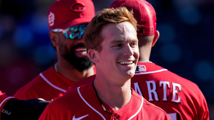 The Reds mob shortstop Matt McLain (78) after his walk-off solo home run.